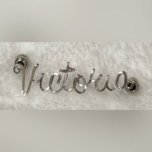 Silver “Victoria” Lapel Brooch.